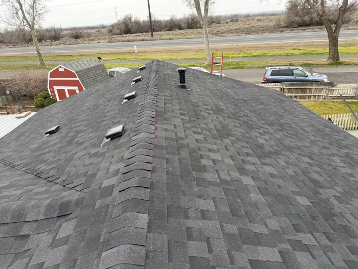 New black shingle roof with box vents