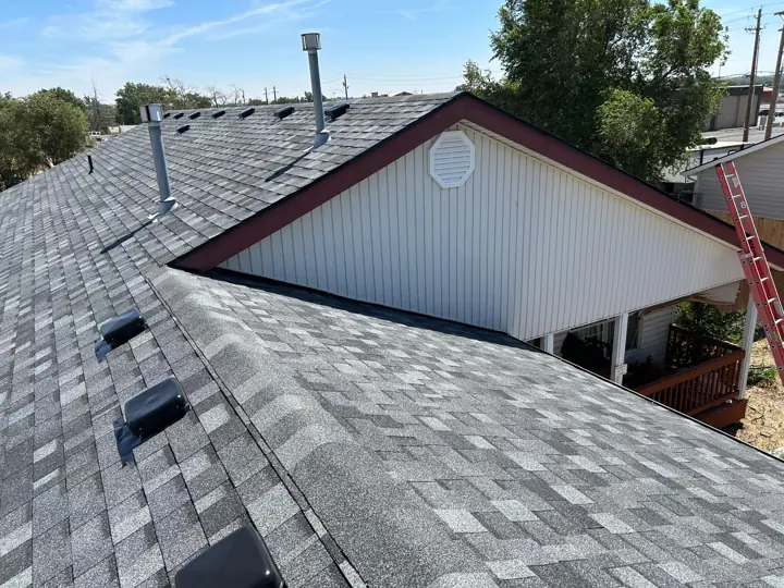 Charcoal shingle roof with new vents and gable