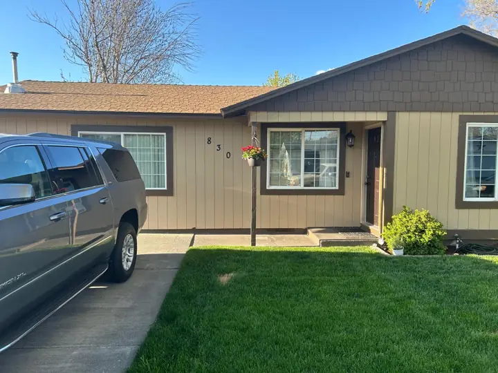 Finished home exterior with a new roof