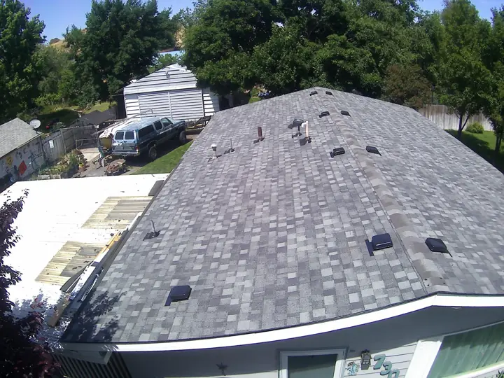 Hip roof with new shingles and vents