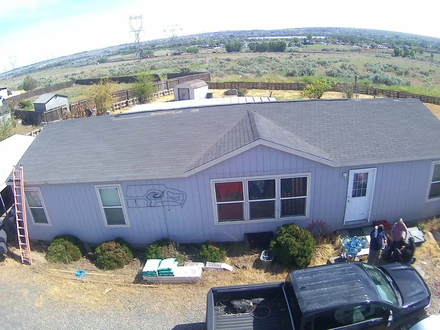 Crew finishing a manufactured home roof