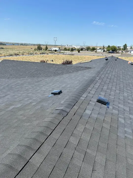 Ridge line with new shingles and vents